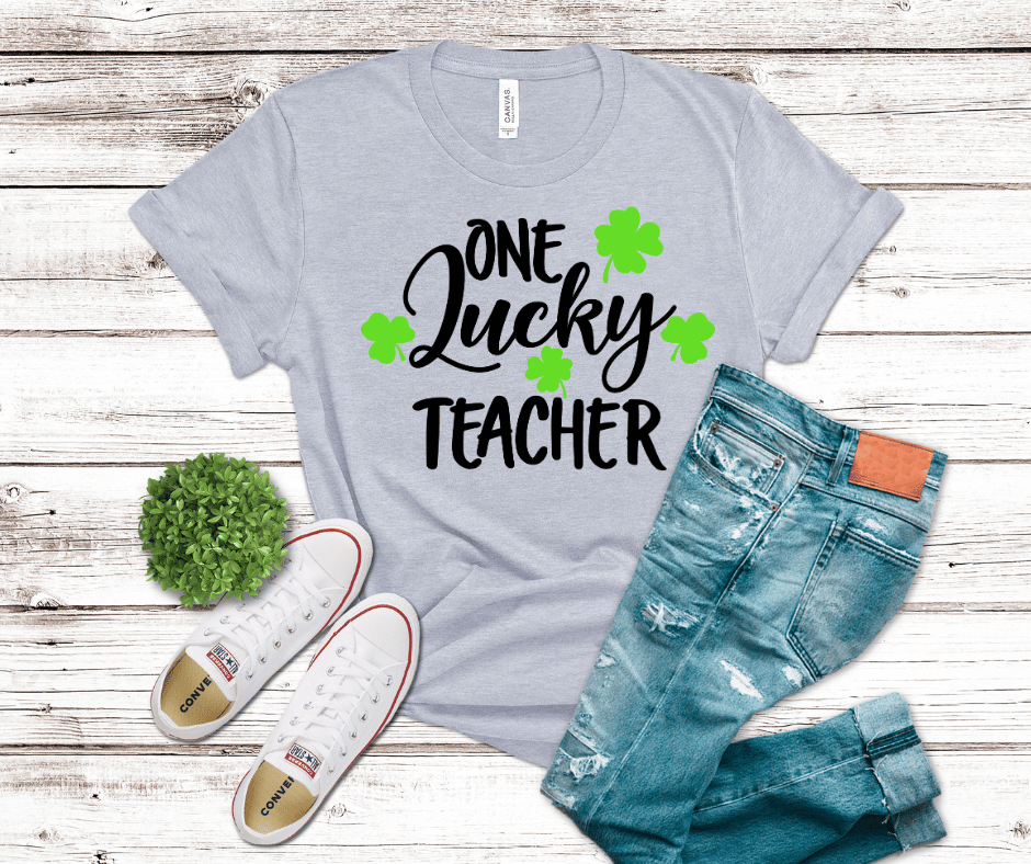 One Lucky Teacher shirt with green shamrocks for St. Patrick’s Day classroom wear.