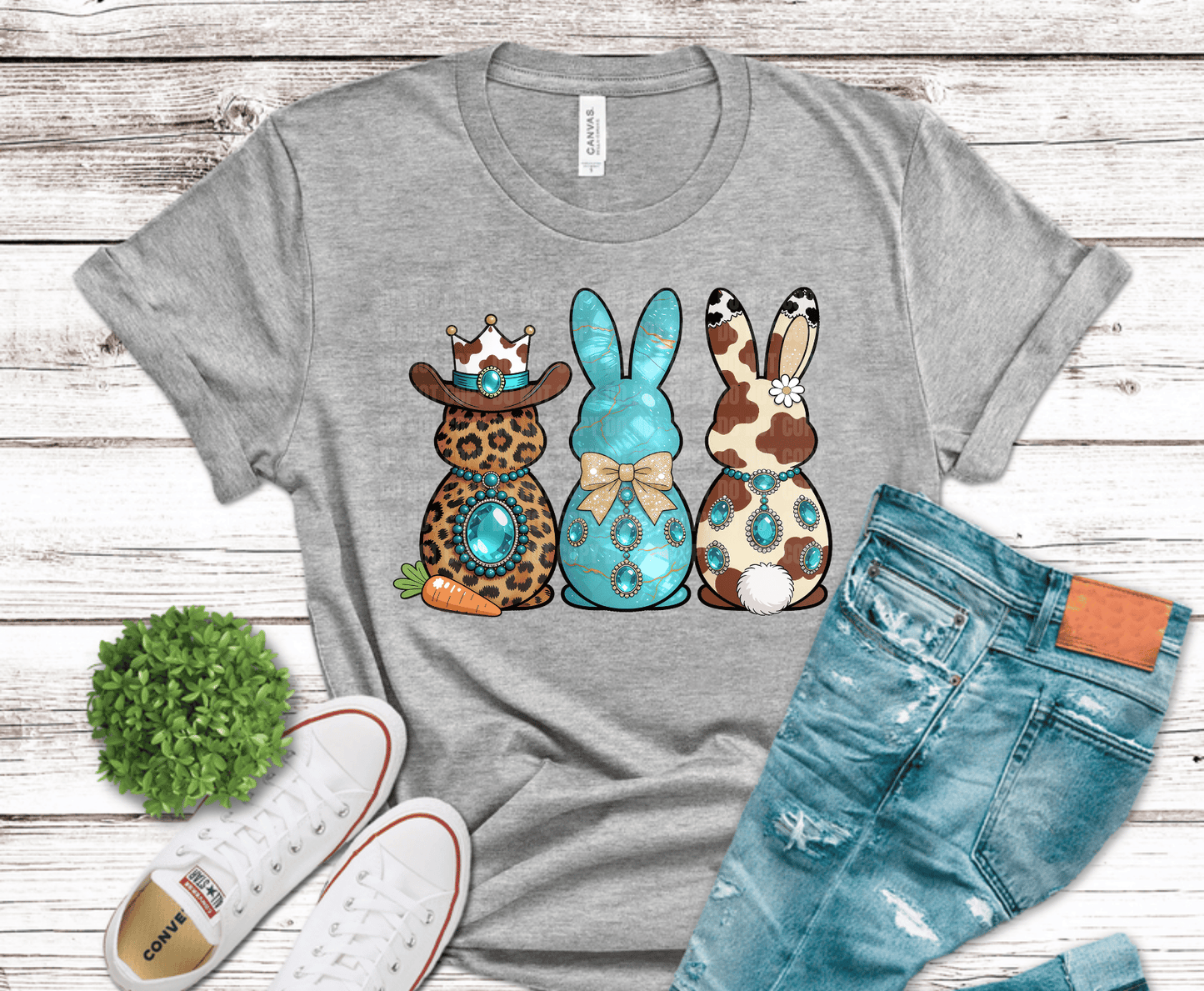 Western Easter bunny trio with cow print, leopard print, and turquoise marble finish featuring rhinestone style jewelry and glam bow design for boutique cowgirl shirts