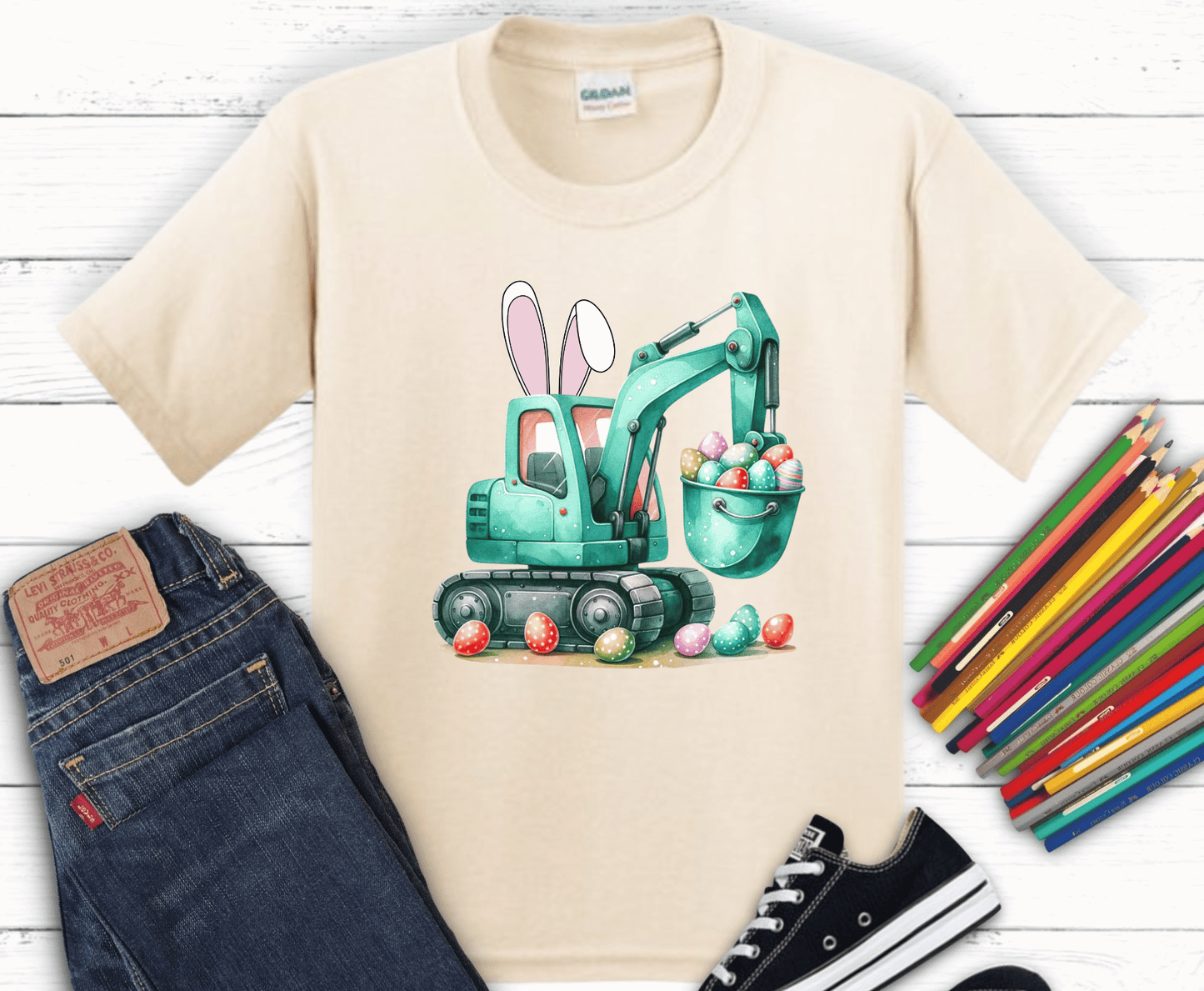 Teal excavator with bunny ears scooping pastel Easter eggs in watercolor style for toddler construction themed Easter shirts