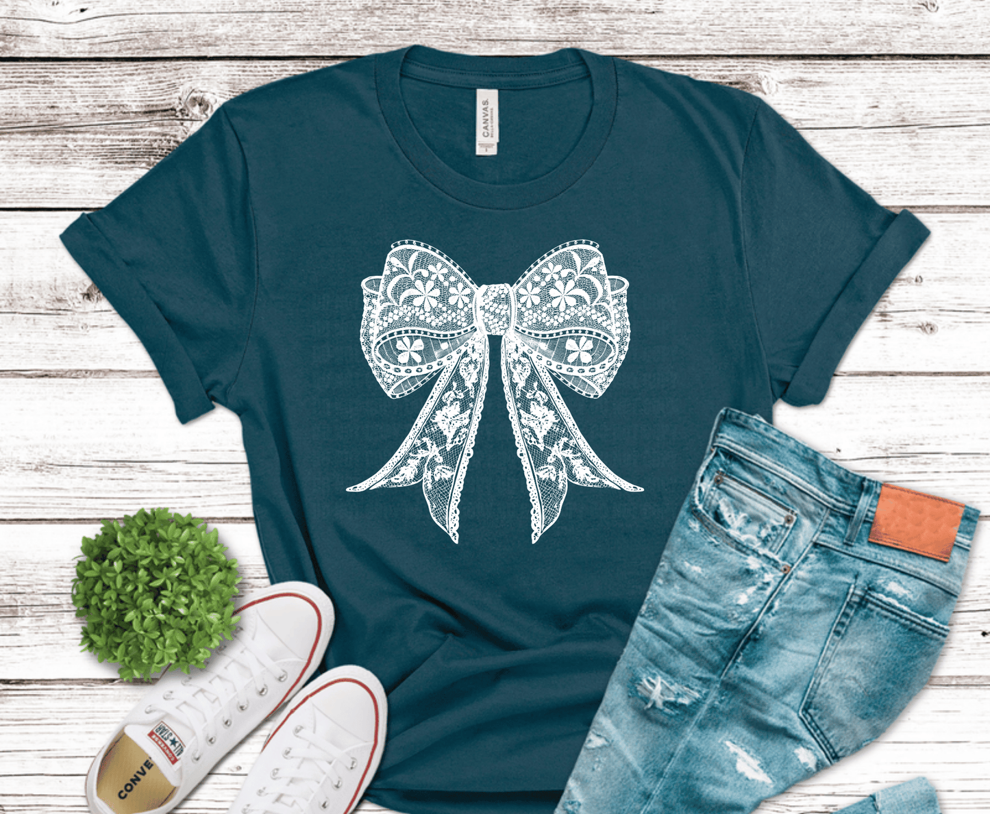Delicate white lace bow with floral detail for feminine boutique shirt design