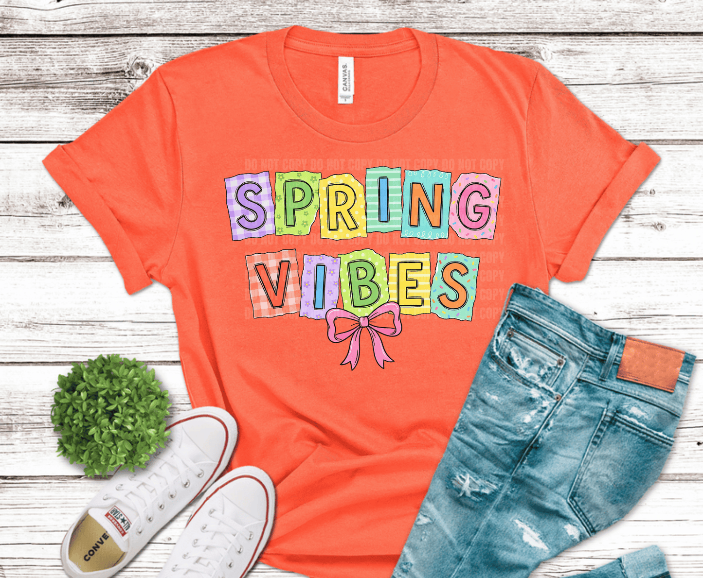 Colorful patch style Spring Vibes lettering with pink bow