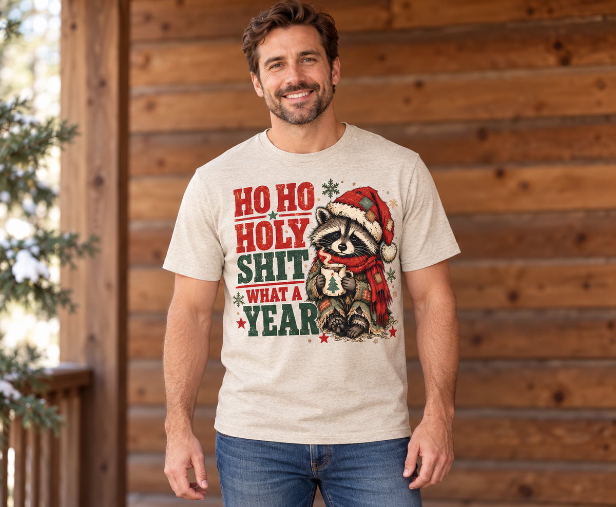 Ho Ho Holy Shit What a Year raccoon Christmas DTF design on an oatmeal shirt mockup