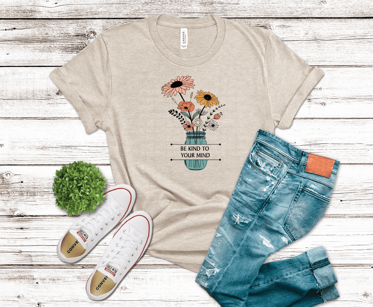 DTF transfer featuring a mason jar filled with colorful boho wildflowers in soft peach, yellow, and sage tones with hand-drawn line details.