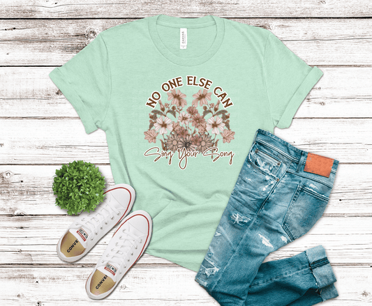 Floral DTF transfer featuring soft pastel flowers and the phrase “No One Else Can Sing Your Song” in a boho inspirational design.