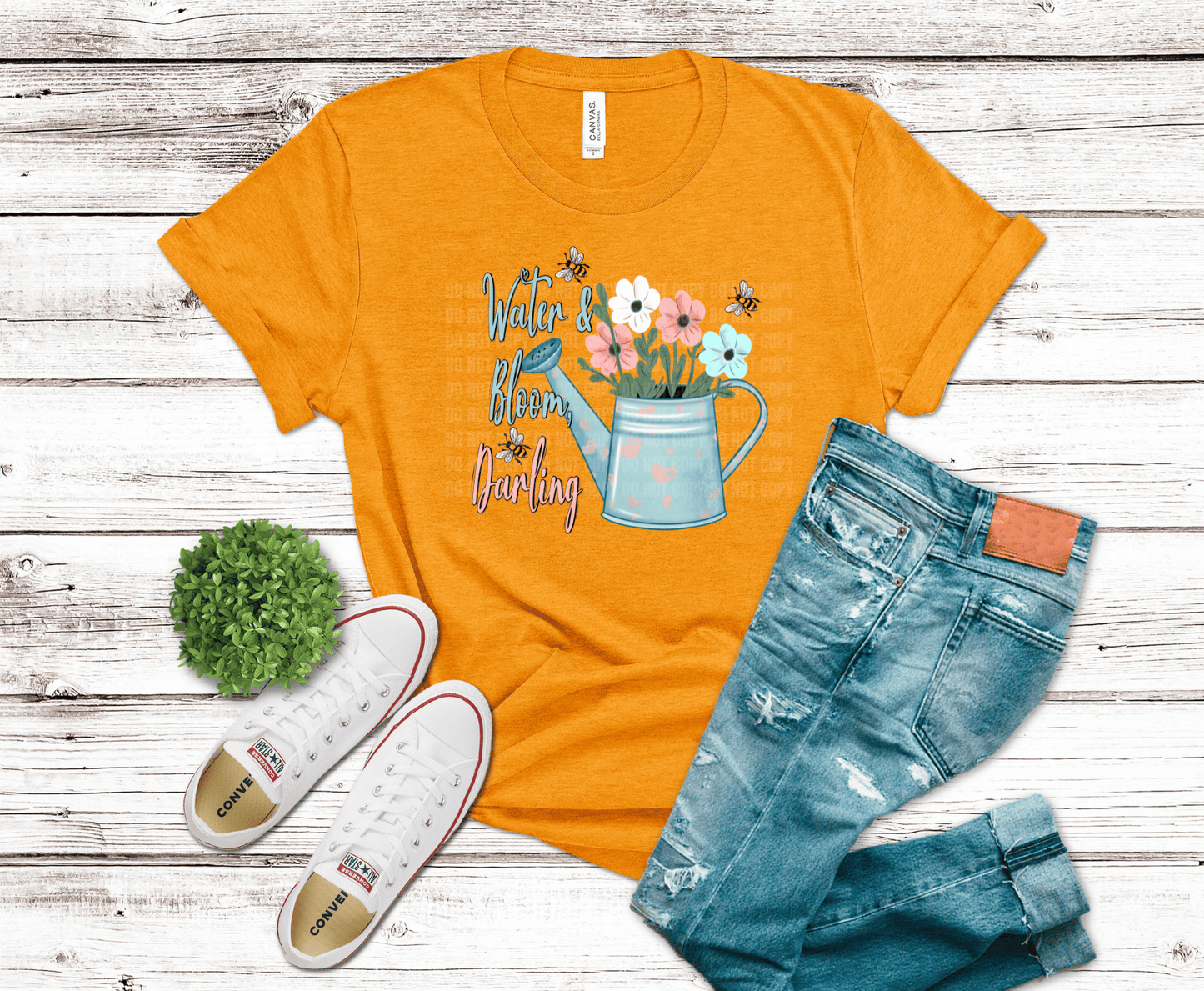 Watering can with flowers and bees with text Water & Bloom Darling.
