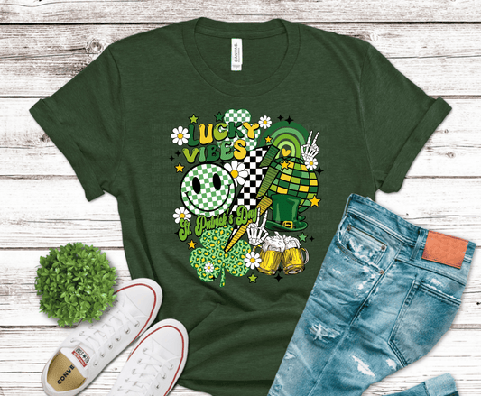 Lucky Vibes St. Patrick’s Day DTF transfer featuring retro shamrocks, smiley faces, beer mugs, and green checkerboard patterns.