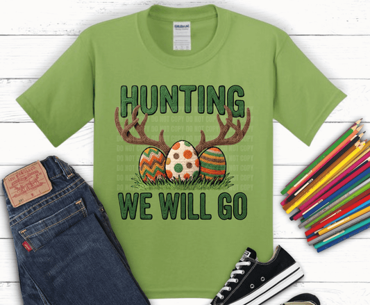 Hunting We Will Go DTF transfer with antlers, crochet Easter eggs, green lettering, and grass for funny hunter Easter shirt design.