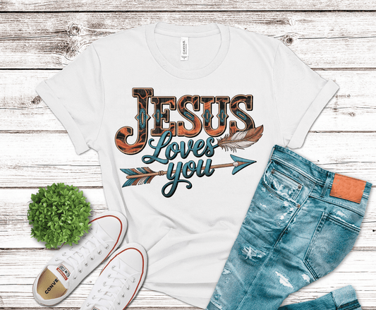 Rustic western style Jesus Loves You DTF transfer with wood-grain lettering and feather arrow design in teal and burnt orange tones.