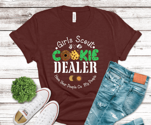 Girl Is Scout Cookie Dealer DTF transfer with green lettering and cookie graphics for Girl Scout cookie season shirt.