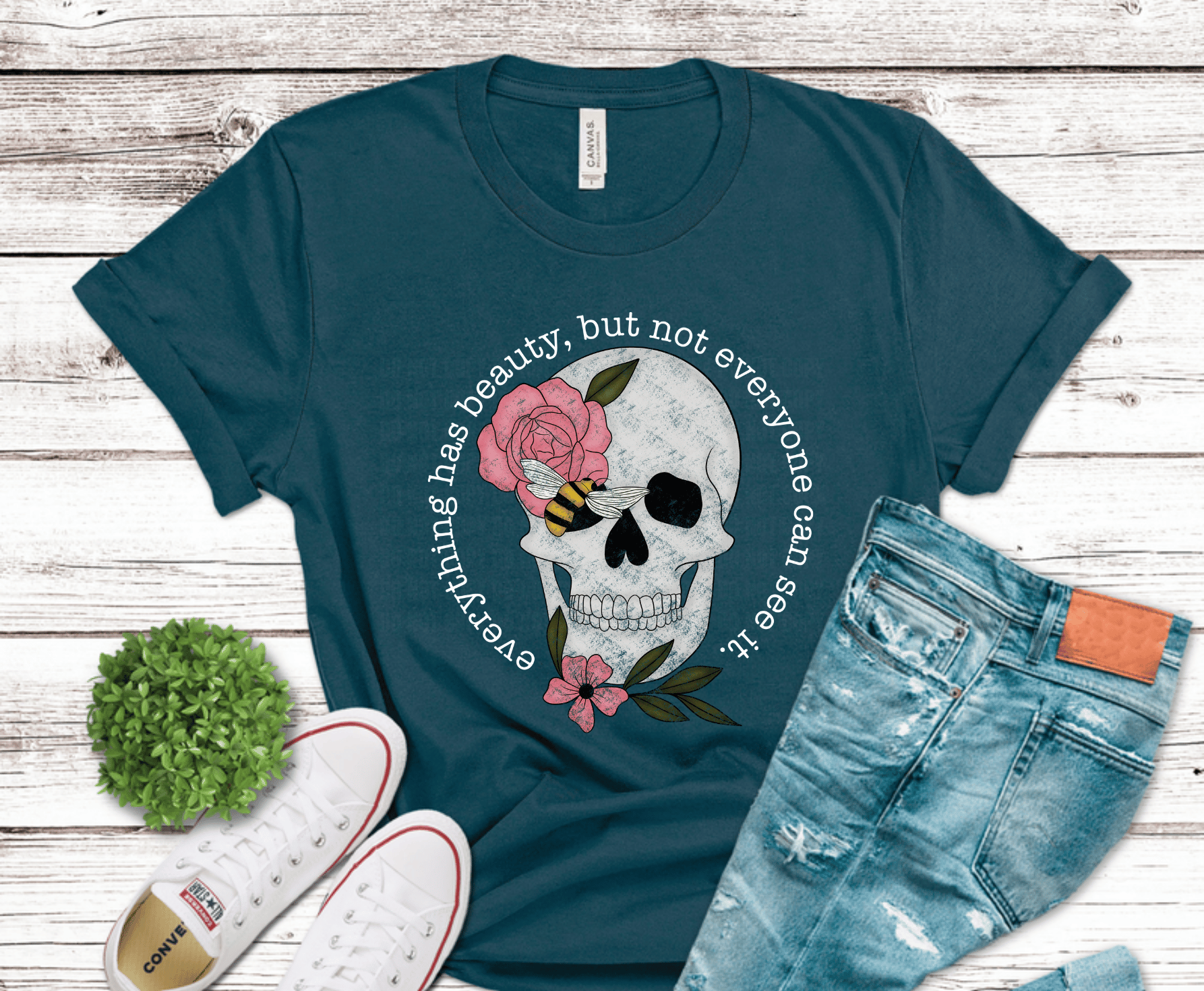 Detailed skull with pink flowers and bee accent for gothic floral shirt design