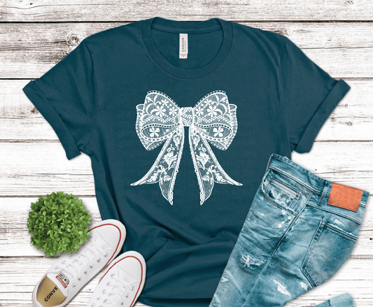 Delicate white lace bow with floral detail for feminine boutique shirt design
