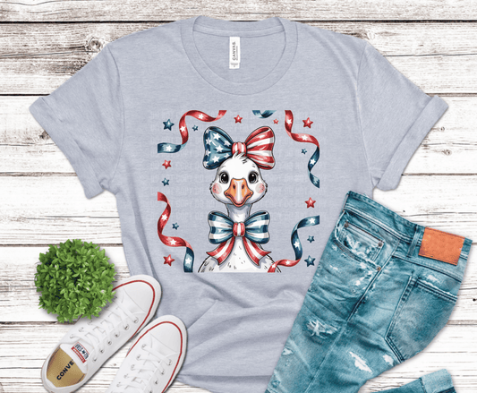Cute goose decorated with red white and blue patriotic bows and ribbons.
