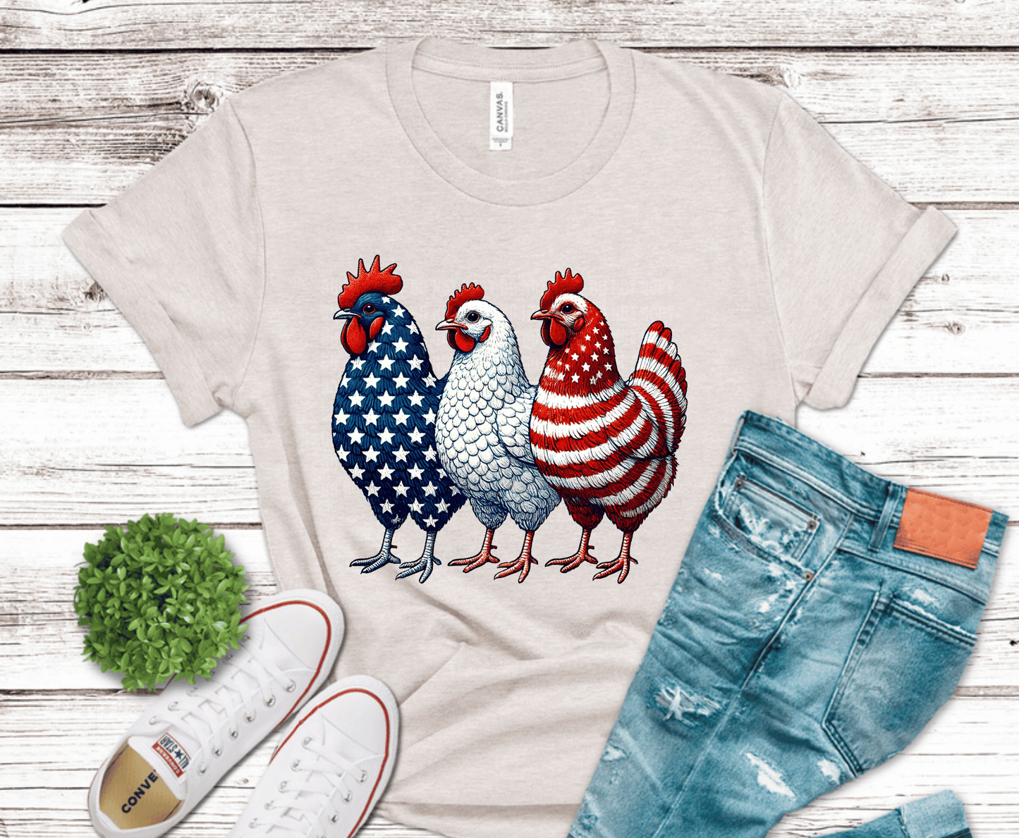 Three chickens decorated in red white and blue American flag patterns.