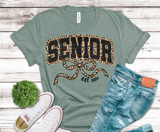 Senior 2026 lettering with leopard print pattern and decorative bow.
