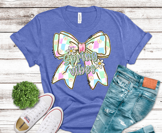 Pastel bow with spring flowers and text Spring Vibes.