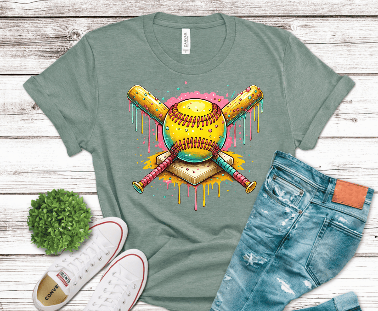 Softball with crossed bats and colorful dripping paint effect.