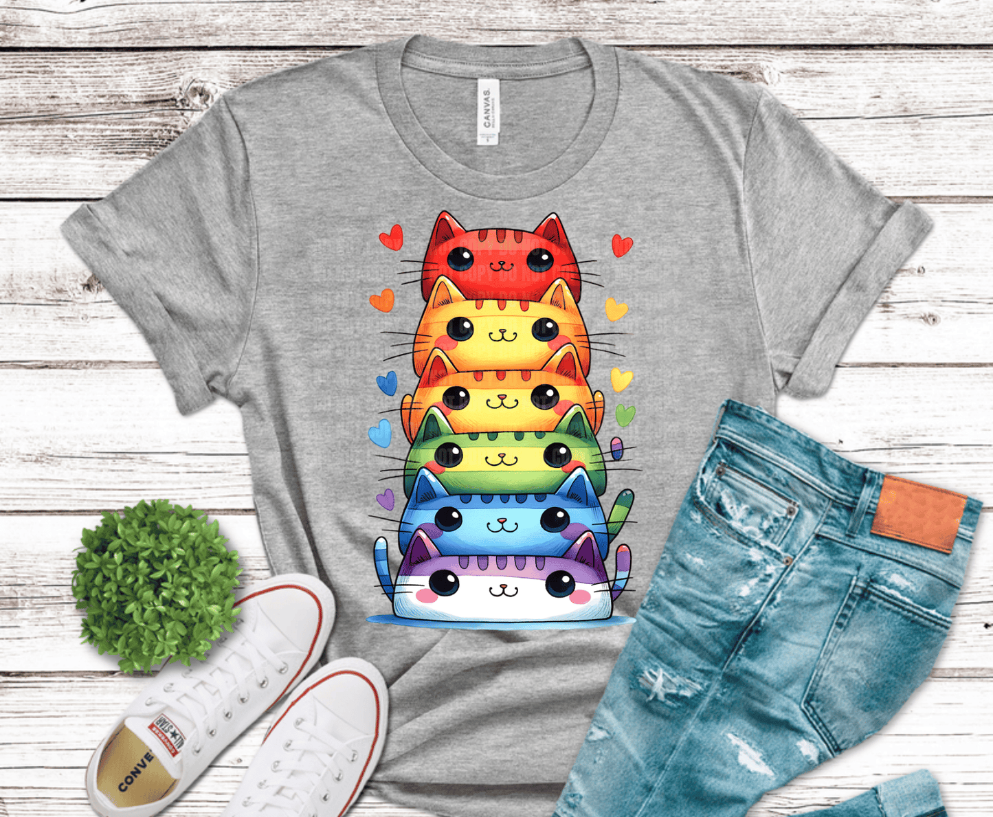 Stacked colorful cartoon cats in rainbow colors.
