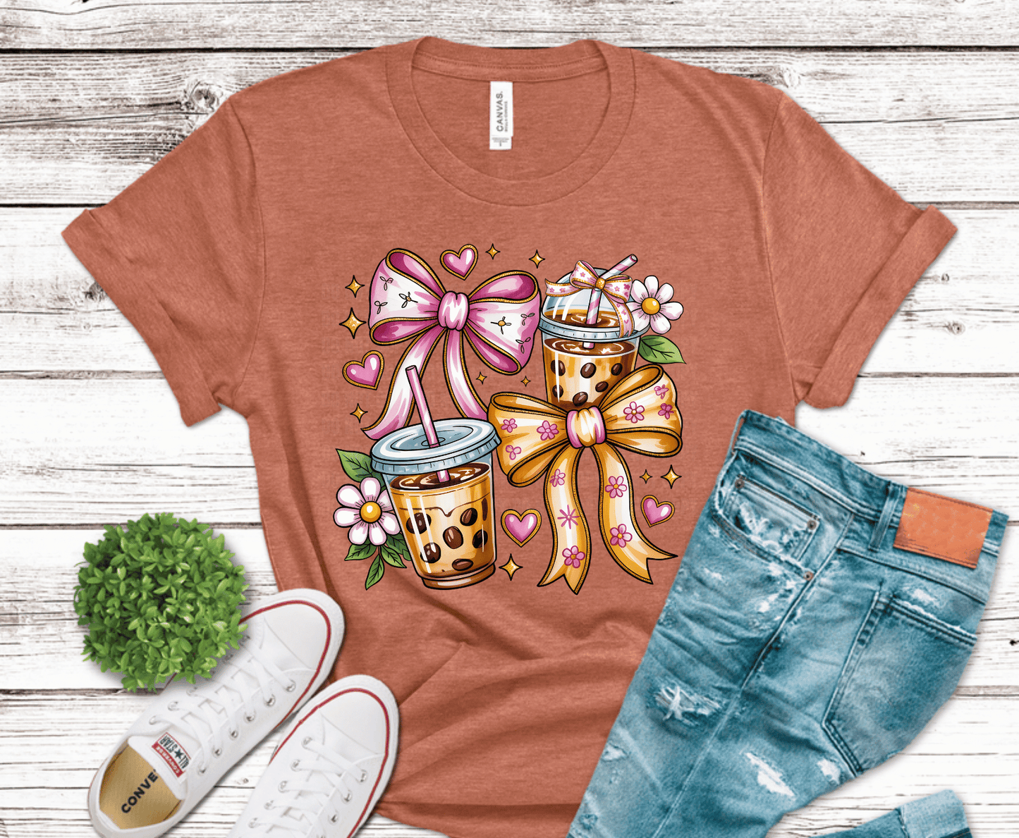 Iced coffee drinks with bows and floral accents.