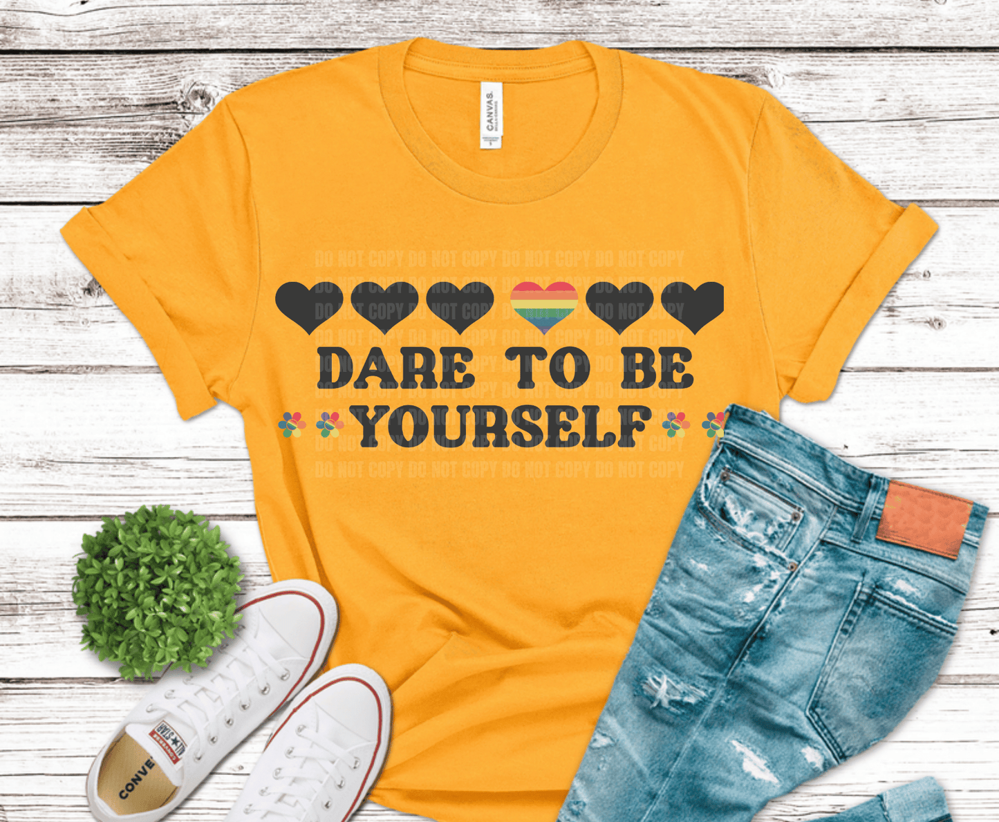 Dare To Be Yourself text with rainbow heart and icons.