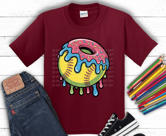 Softball with colorful dripping icing and sprinkles.