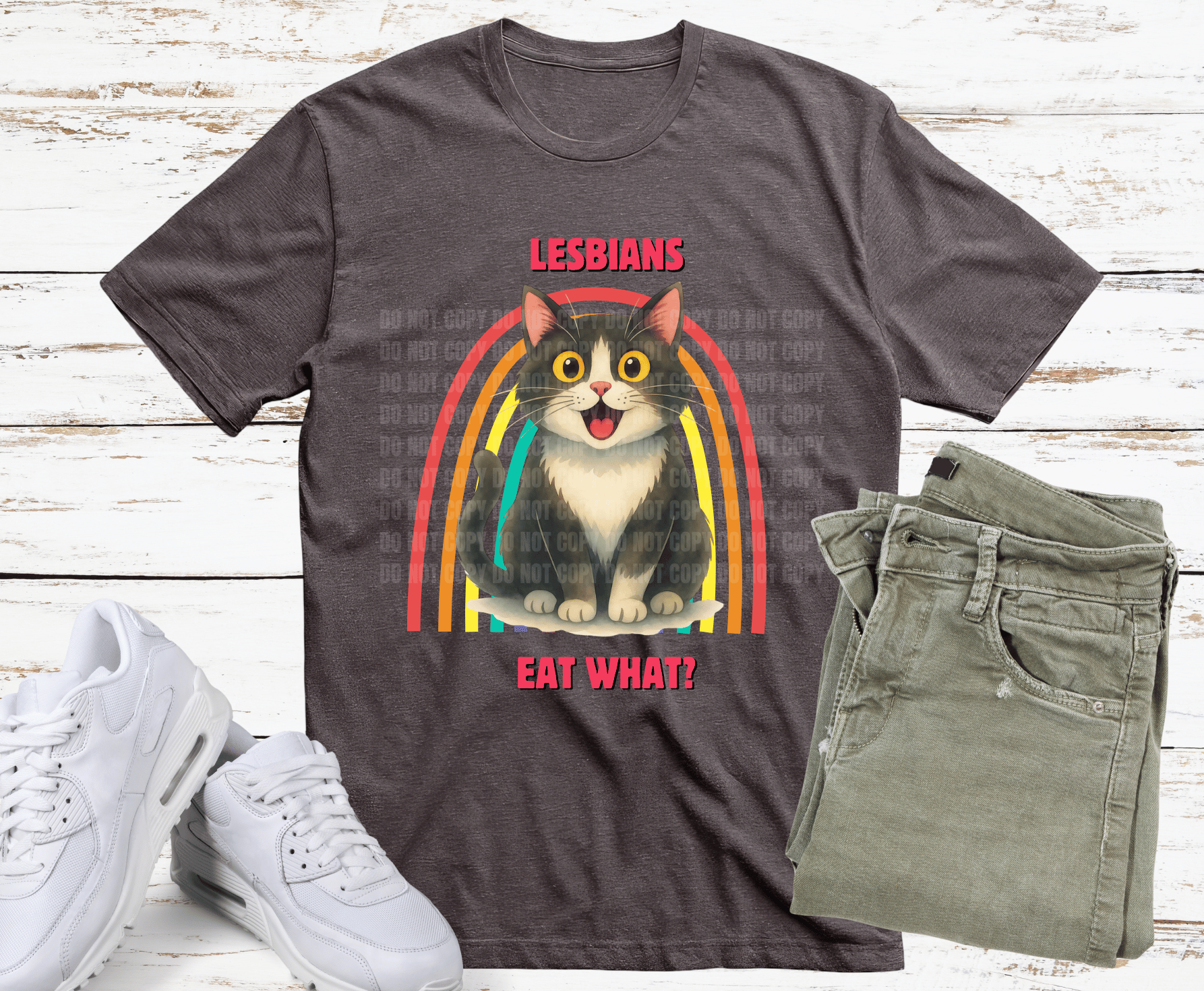 Cat with rainbow background and humorous pride text.