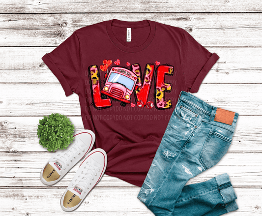 LOVE DTF transfer featuring leopard print letters, a pink school bus, and Valentine heart accents for teacher apparel.
