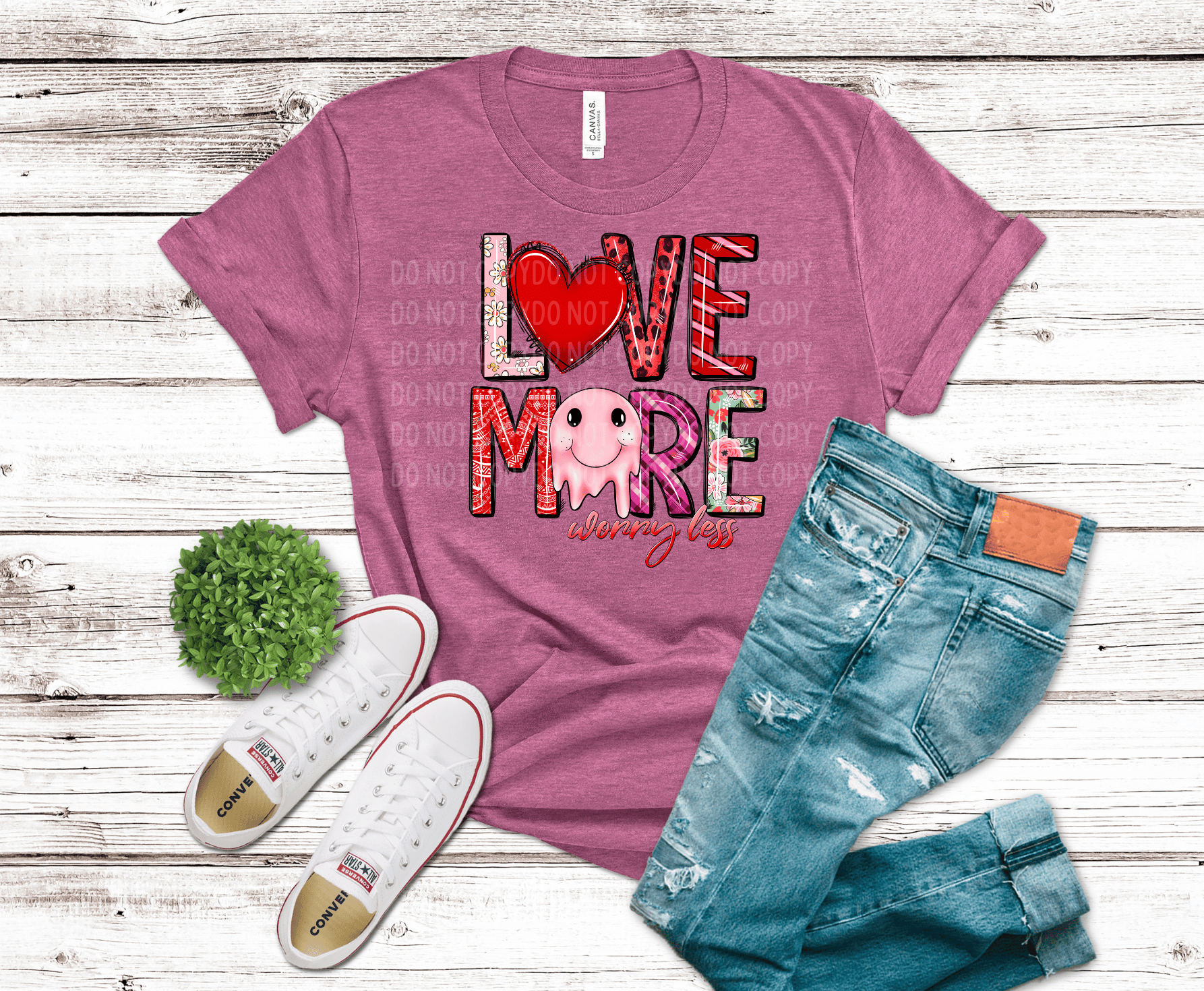 “Love More Worry Less” text with mixed patterns and a smiling heart character in red and pink tones, cute Valentine-style DTF transfer design.