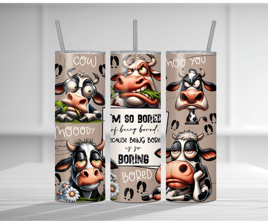 Humorous 20oz tumbler sublimation wrap featuring multiple cartoon cows with bored and moody expressions, cow puns like "Cow Moody" and "I'm so bored of being bored because being bored is so BORING" on a beige background with hoof prints.