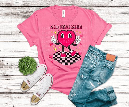Self Love Club DTF transfer featuring a pink cartoon heart character with peace signs, sparkles, checkerboard floor, and Valentine vibes.