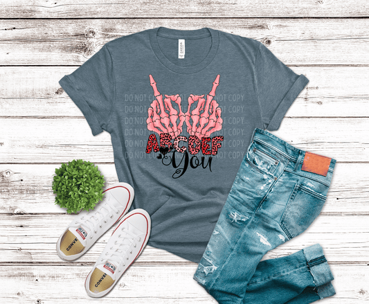 Pink skeleton hands making a bold gesture above “ABCDE F You” text with leopard print lettering, edgy Valentine-themed DTF transfer design.